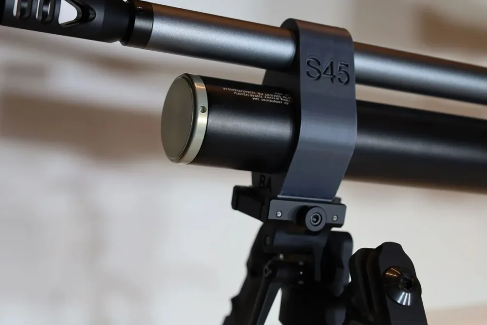 Here's an alt tag for the image: S45 air rifle mounted on tripod.