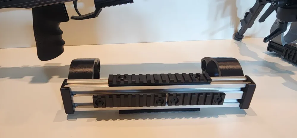Here's an alt tag for the image: 3D printed gun barrel rest with rails.