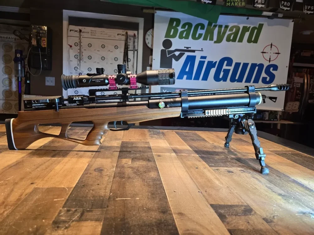 Airgun rifle on wooden table.