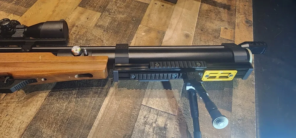 Here's an alt tag for the image: Air rifle with scope and bipod.